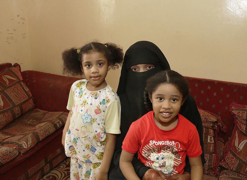 Layla Yousif with her daughters, Mariam, 5, and Mahra, 4. The woman is seeking financial assistance from her husband. Jeffrey E Biteng / The National