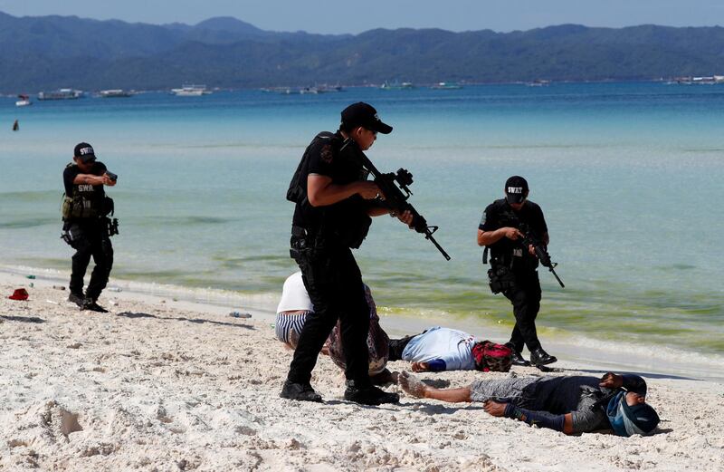 Members of the police SWAT team take part in a hostage taking drill, a day before the temporary closure of the holiday island Boracay, in the Philippines on April 25, 2018. Erik De Castro / Reuters