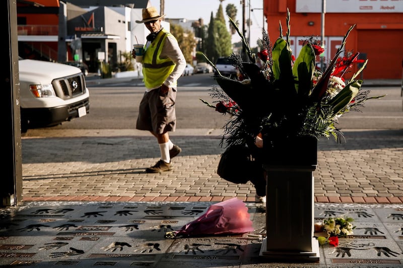 A person looks at a makeshift memorial next to Eddie Van Halen's hand prints on Hollywood's Rock Walk in Hollywood, California. EPA