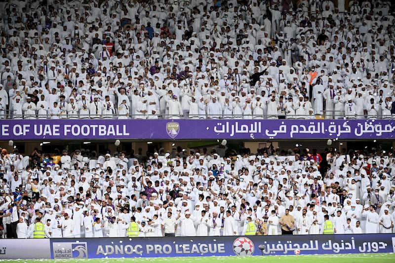 Al Ain supporters celebrate the team's title win.