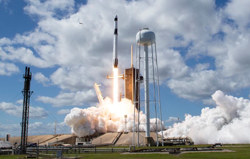 A SpaceX Falcon 9 rocket carrying the Crew Dragon capsule lifts off at the Kennedy Space Centre in Florida on Wednesday. EPA