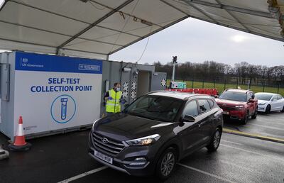 Covid test kits are handed out at a testing site at Edinburgh Airport, Scotland. PA