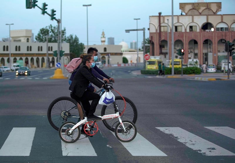 Abu Dhabi, United Arab Emirates, May 2, 2020.  A couple take a bike ride at the Al mina area as the sun sets on Saturday.Victor Besa / The NationalSection:  NAFor:  Standalone / Stock images