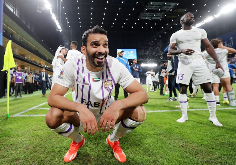 Al Ain's Khalid Al Hashmi celebrates with teammates after the game.