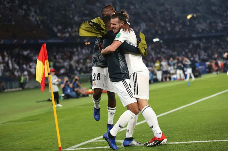 Real Madrid's midfielder Gareth Bale, right, celebrates with teammates after scoring his side's second goal. AP Photo