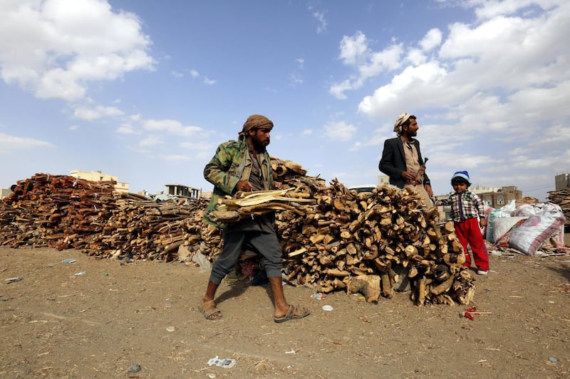 A Yemeni vendor (L) displays firewood for sale amid ongoing cooking gas shortage in Sana'a, Yemen. Yahya Arhab / EPA