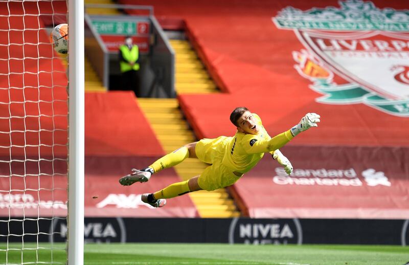 LIVERPOOL, ENGLAND - JULY 11: Nick Pope of Burnley reacts whilst he attempts to make a save, as Andy Robertson of Liverpool (not pictured) scores his team's first goal during the Premier League match between Liverpool FC and Burnley FC at Anfield on July 11, 2020 in Liverpool, England. Football Stadiums around Europe remain empty due to the Coronavirus Pandemic as Government social distancing laws prohibit fans inside venues resulting in all fixtures being played behind closed doors. (Photo by Oli Scarff/Pool via Getty Images)