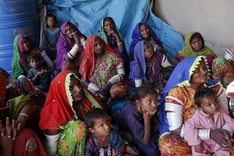 Women cotton pickers sit and listen during a leadership and advocacy skills workshop organized by the Sindh Community Foundation (SCF), in Meeran Pur village, north of Karachi. Akhtar Soomro / REUTERS