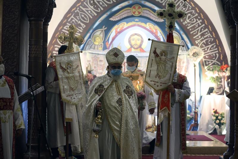 An Orthodox Christian priest leads an Easter Mass at a church in Heliopolis, Cairo. EPA