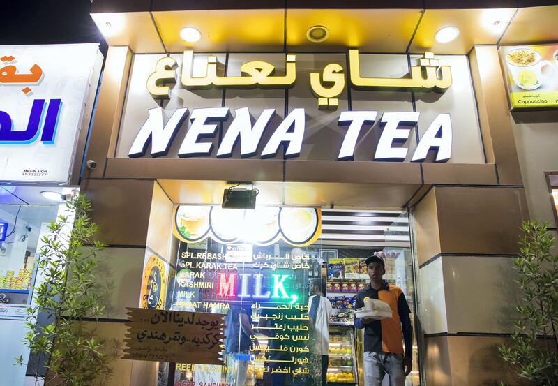 Ras Al Khaimah, United Arab Emirates - September 20th, 2017: People collect there tea from Nena Tea. A traditional fishing neighbourhood in Old RAK has been transformed by karak coffee and tea shops that have popped up in the last two years. Wednesday, September 20th, 2017, Old RAK, Ras Al Khaimah. Chris Whiteoak / The National