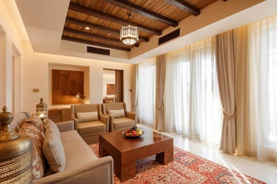 The living area in the one-bedroom villa, with a separate dining nook. Photo: Al Wathba, a Luxury Collection Desert Resort & Spa