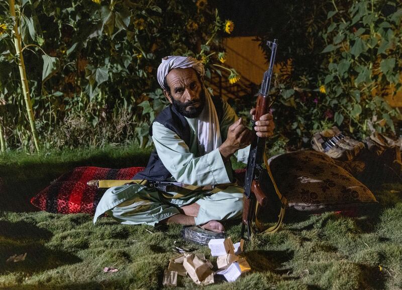 A militaman loads his rifle as Afghan Special Forces visit a district centre during a combat mission against the Taliban in Kandahar province, July 12, 2021.