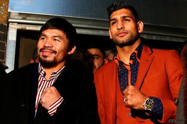 Amir Khan, right, has claimed a contract has been signed to fight Manny Pacquio, a claim Pacquiao's team have denied. Getty Images