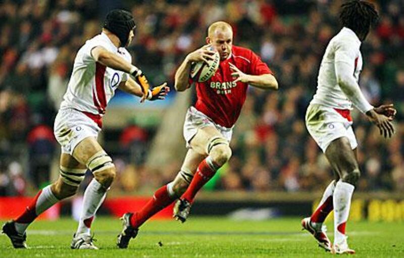 Martyn Williams, centre, displays his skill with ball in hand the last time Wales met England at Twickenham, in 2008.