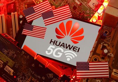 FILE PHOTO: The U.S. flag and a smartphone with the Huawei and 5G network logo are seen on a PC motherboard in this illustration taken January 29, 2020. REUTERS/Dado Ruvic/Illustration/File Photo