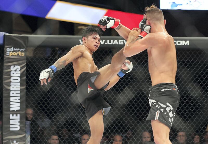 Abu Dhabi, United Arab Emirates - November 29th, 2019: Trent Girdham (black gloves) takes on Jayson Margallo in the bantamweight division during the UAE Warriors event. Friday, November 29th, 2019, Mubadala Arena, Abu Dhabi. Chris Whiteoak / The National