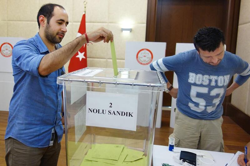 Caner Soydal, left, and Aydin Ozkaynok, Turkish citizens living in Abu Dhabi, were able to vote in their country’s upcoming presidential election at the Turkish embassy in Abu Dhabi. Delores Johnson / The National