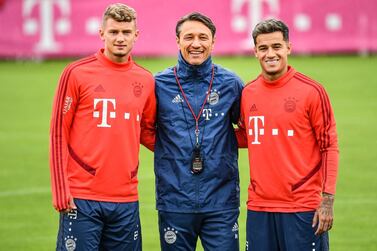 epa07781821 Bayern's head coach Niko Kovac (C) poses with his new players Michael Cuisance (L) and Philippe Coutinho (R) during a training session in Munich, Germany, 20 August 2019. EPA/PHILIPP GUELLAND