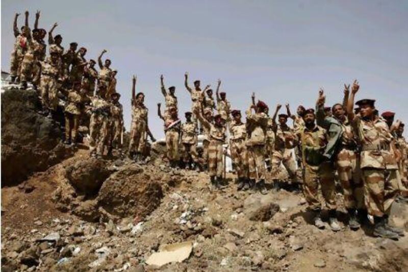 Yemeni soldiers who joined sides with anti-regime protesters wave their rifles and chant slogans during a demonstration demanding the resignation of Yemeni President Ali Abdullah Saleh, as pro- and anti-regime activists held rallies with loyalists celebrating news that Yemen's president was out of intensive care in Riyadh after treatment for bomb blast wounds.