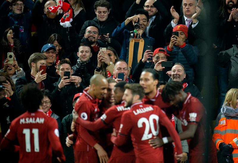 epa07402761 Liverpool fans take photographs of the Liverpool players after Liverpool's Virgil van Dijk scores the fifth goal during the English Premier League soccer match between Liverpool and Watford held at the Anfield in Liverpool, Britain, 27 February 2019.  EPA/PETER POWELL EDITORIAL USE ONLY. No use with unauthorized audio, video, data, fixture lists, club/league logos or 'live' services. Online in-match use limited to 120 images, no video emulation. No use in betting, games or single club/league/player publications