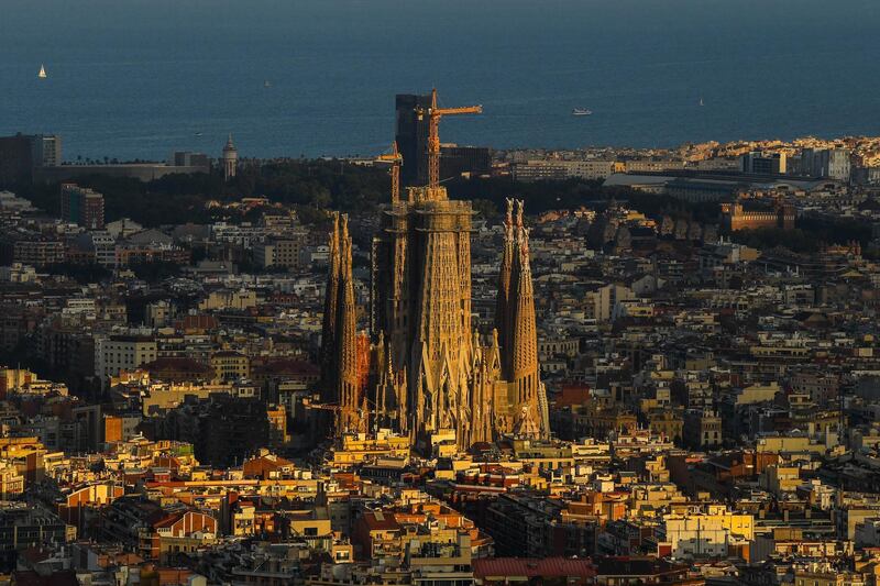 BARCELONA, SPAIN - JULY 18: A view of La Sagrada Familia stands over residential buildings during the first day the new Catalan government recommendations and regulations on the fight against COVID-19 take effect on July 18, 2020 in Barcelona, Spain. The Catalan capital's five million residents have been advised to stay home after the number of Coronavirus cases spiked in the past week. (Photo by David Ramos/Getty Images)