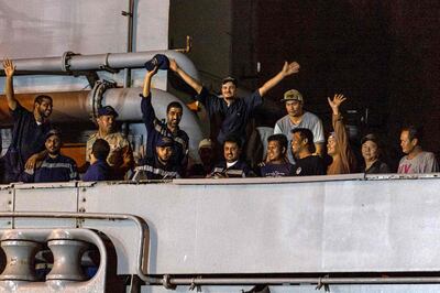 Members of the Saudi Navy Forces and evacuees on the deck of a ship upon arrival at King Faisal navy base in Jeddah, following a rescue operation from Sudan. SPA 