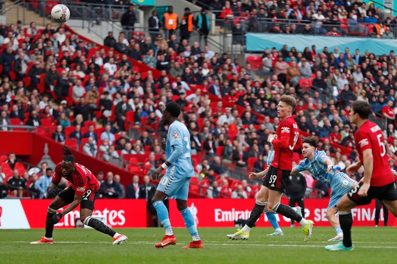Callum O'Hare's shot deflects off United defender Aaron Wan-Bissaka, left, and into the net for Coventry's second goal. AFP