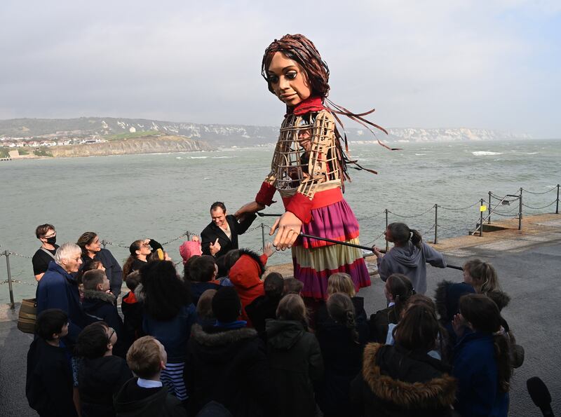 British actor Jude Law greeted Little Amal as she arrived in Folkstone. The 3.5-metre puppet traversed Europe over four months on stilts and reached UK shores on October 19, on the final leg of an 8,000-kilometre journey.  EPA