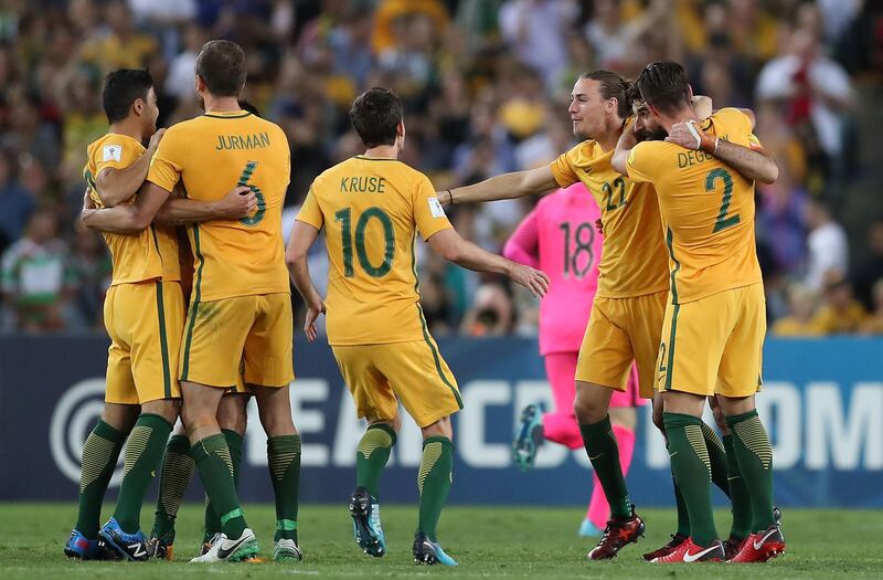 Australia players celebrate victory. Mark Metcalfe / Getty Images