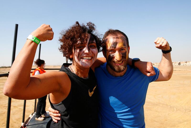 Jubilant competitors reflect the Tough Mudder aim of challenging yourself while having fun, at O West district, in Giza, Egypt. Reuters