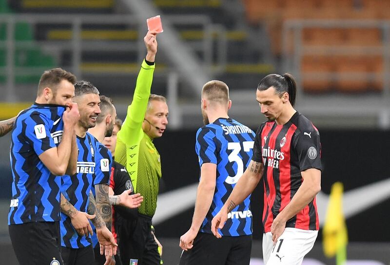 Milan's Zlatan Ibrahimovic is shown a red card by referee Paolo Valeri. Reuters