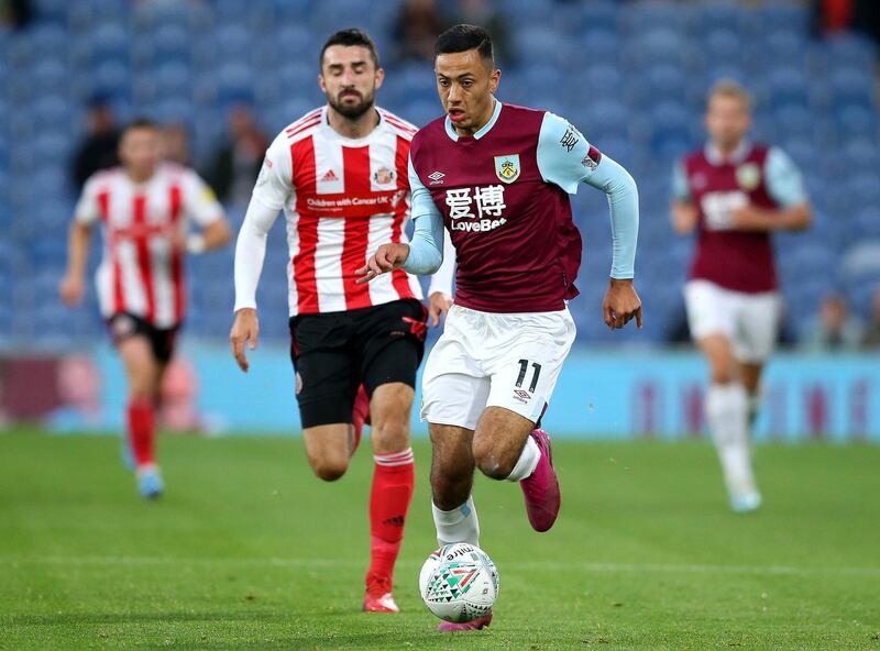 BURNLEY, ENGLAND - AUGUST 28: Dwight McNeil of Burnley battles for possession with Conor McLaughlin of Sunderland AFC during the Carabao Cup Second Round match between Burnley and Sunderland at Turf Moor on August 28, 2019 in Burnley, England. (Photo by Jan Kruger/Getty Images)