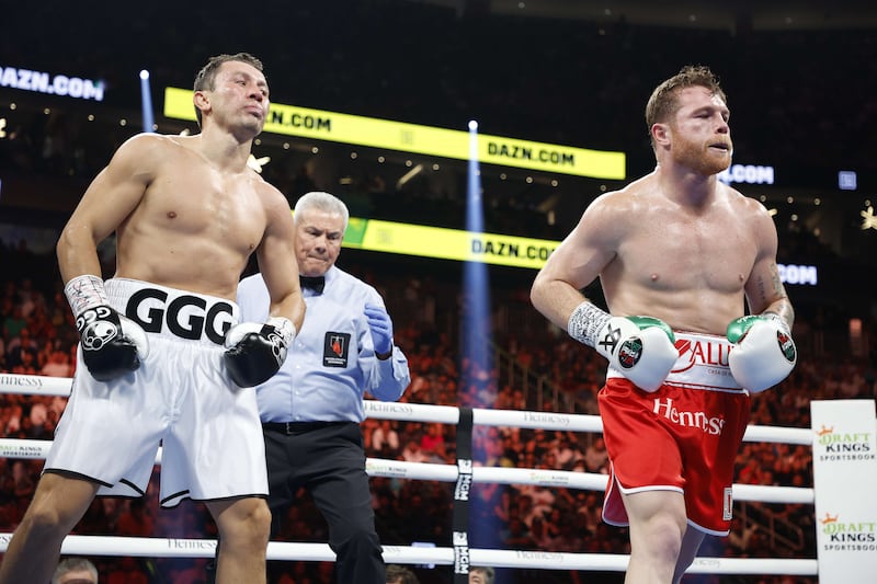 Canelo Alvarez and Gennady Golovkin go to their corners at the end of a round. Getty