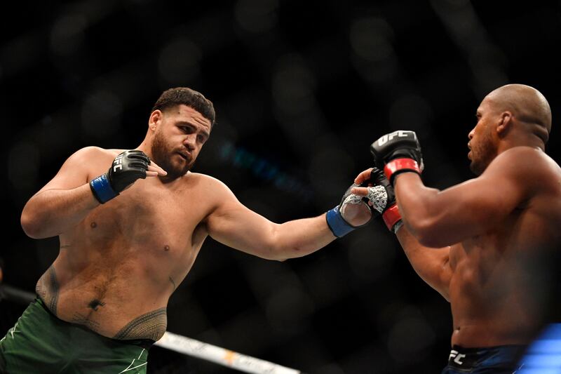 Ciryl Gane parries a punch from Tai Tuivasa during their heavyweight fight at the UFC event in Paris. AFP