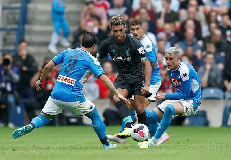 Liverpool's Alex Oxlade-Chamberlain in action with Napoli's Simone Verdi at Murrayfield in Edinburgh, Scotland on Sundya. Napoli ran out 3-0 winners in the pre-season friendly. Reuters