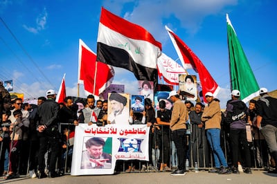 Supporters of Shiite Muslim cleric Moqtada Al Sadr call for boycott of the 2023 council elections at a protest in the city of Nasiriyah, in Iraq's southern Dhi Qar province. AFP