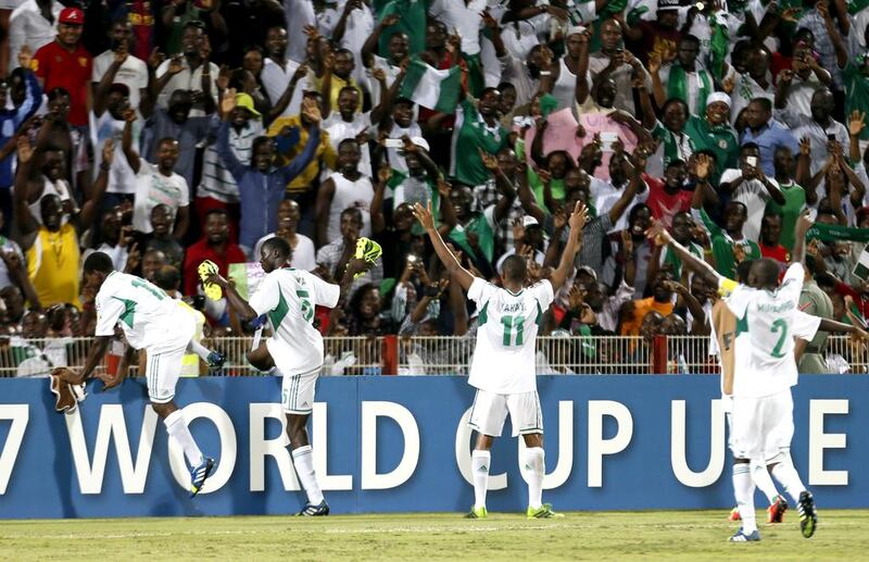 Nigerian team players celebrate their 3-0 win over Sweden following the two teams' semi-final in the FIFA U-17 World Cup in Dubai's Rashid Stadium on Wednesday. Nigeria will meet Mexico in the finals on Friday in Abu Dhabi. Karim Sahib / AFP