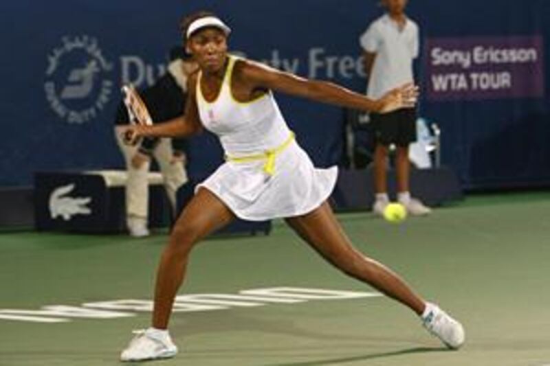 Venus Williams hits a return during her straight sets win over France´s Virginie Razzano in Saturday night's women's final of  the Dubai Tennis Championship.