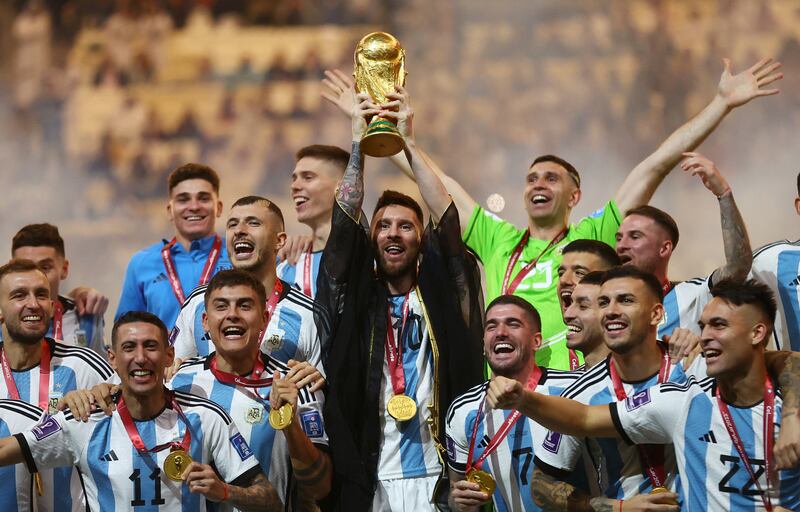 Argentina's Lionel Messi lifts the World Cup trophy. Reuters