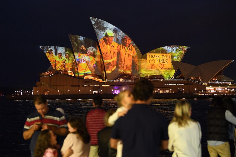 The sails of the Opera House are lit with a series of images to show support for the communities affected by the bushfires and to express the gratitude to the emergency services and volunteers in Sydney.  AFP