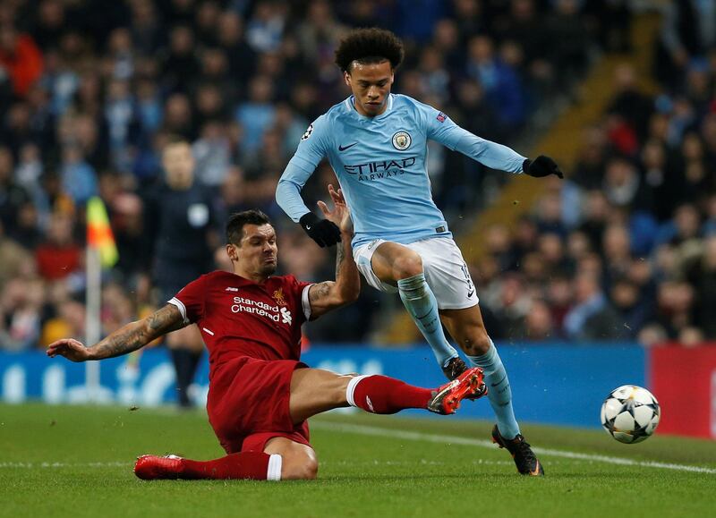 Manchester City's Leroy Sane is tackled by Liverpool's Dejan Lovren. Andrew Yates / Reuters