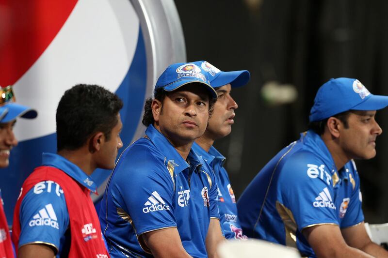 
ABU DHABI , UNITED ARAB EMIRATES Ð April 16 , 2014 : Sachin Tendulkar ( center )  of Mumbai Indians during the IPL opening match between Mumbai Indians vs Kolkata Knight Riders at Zayed Cricket Stadium in Abu Dhabi. ( Pawan Singh / The National ) For Sports. Story by Osman