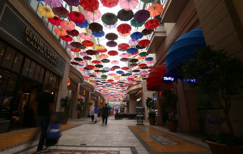 A passageway covered with umbrellas. AFP 