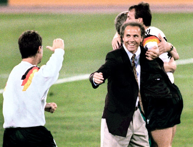 West Germany coach Franz Beckenbauer, centre, celebrates after his team beat the defending champions Argentina 1-0 in the World Cup final, July 8, 1990 in Rome. AFP