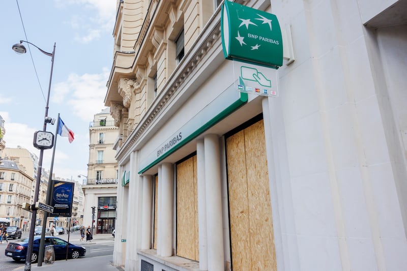 Branch of BNP Paribas bank on Rue La Boetie in Paris with windows boarded up amid nationwide rioting. EPA