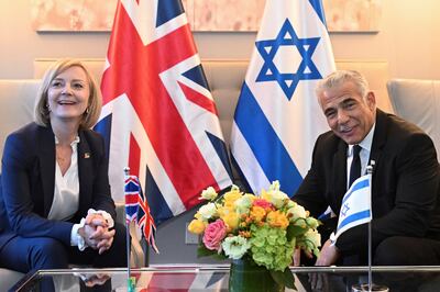 Liz Truss told Israeli Prime Minister Yair Lapid she would look into moving the UK embassy from Tel Aviv to Jerusalem during a bilateral meeting in New York in September. AP
