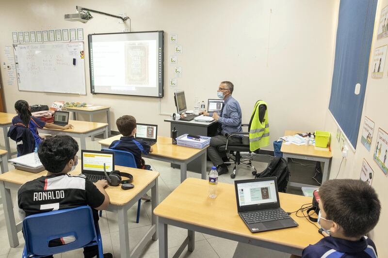 RAS AL KHAIMAH, UNITED ARAB EMIRATES. 28 OCTOBER 2020. RAK Academy International Secondary School-ISK has provided students with Chrome Book laptops to aid in their studies. Students in a class room lesson use the Chrome Book while being able to maintain social distancing. (Photo: Antonie Robertson/The National) Journalist: Ruba Haza. Section: National.
