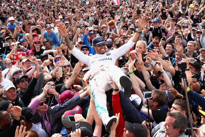 Hamilton celebrates after winning the British Grand Prix at Silverstone on July 10, 2016. Getty Images