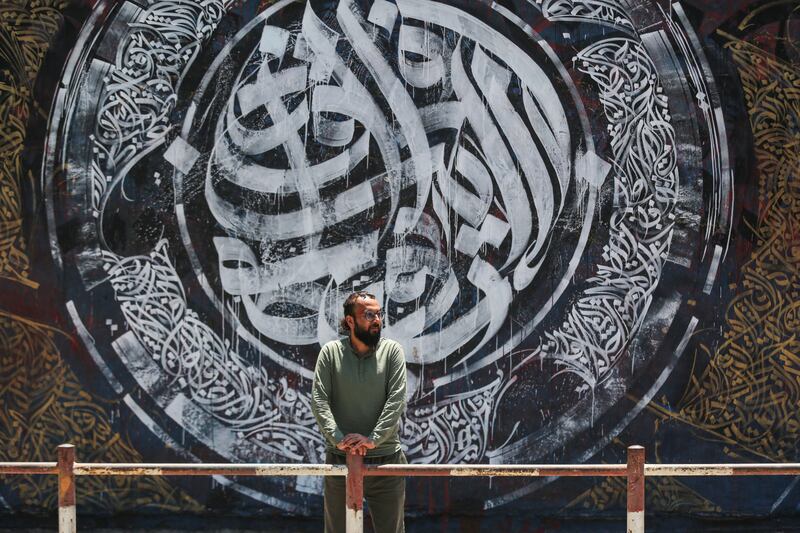 Bilal Khaled and artwork at Alazhar University in Gaza City