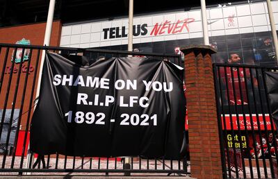Banners are placed outside of Anfield, home of Liverpool FC by fans to protest against its decision to be included amongst the clubs attempting to form a new European Super League. Picture date: Monday April 19, 2021. PA Photo. It was announced on Sunday that Arsenal, Chelsea, Liverpool, Manchester City, Manchester United and Tottenham are among 12 clubs who have committed to the project. See PA story SOCCER European. Photo credit should read: Peter Byrne/PA Wire.
